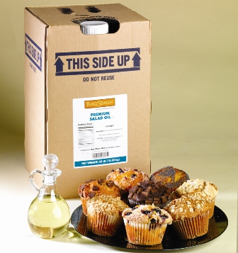 Plate of assorted muffins in front of a container of oil