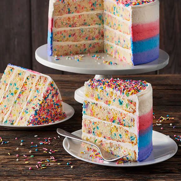 slide of colorful cake with numerous sprinkles on a plate