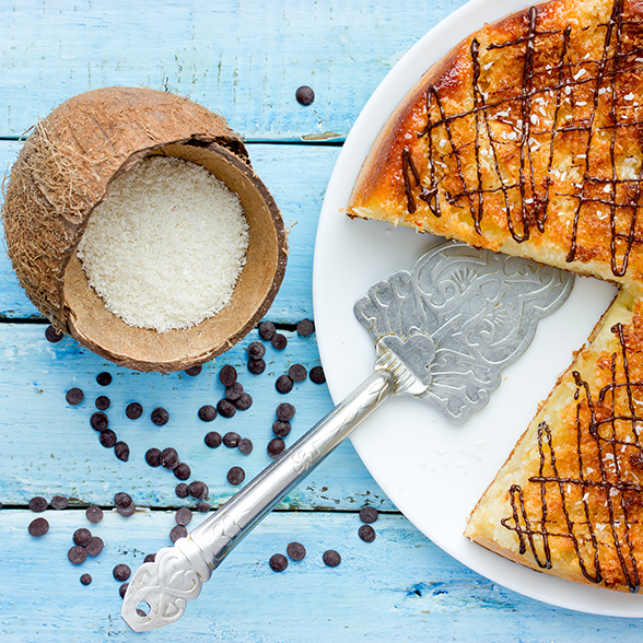 Coconut cake with a slice removed