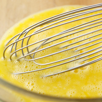 Eggs being whisked in a bowl