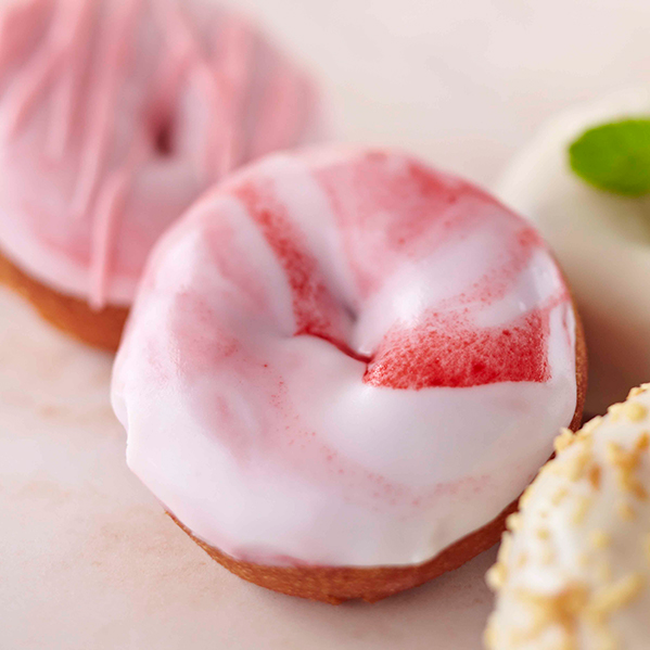 Glazed cake donuts with an assortment of flavors and colors