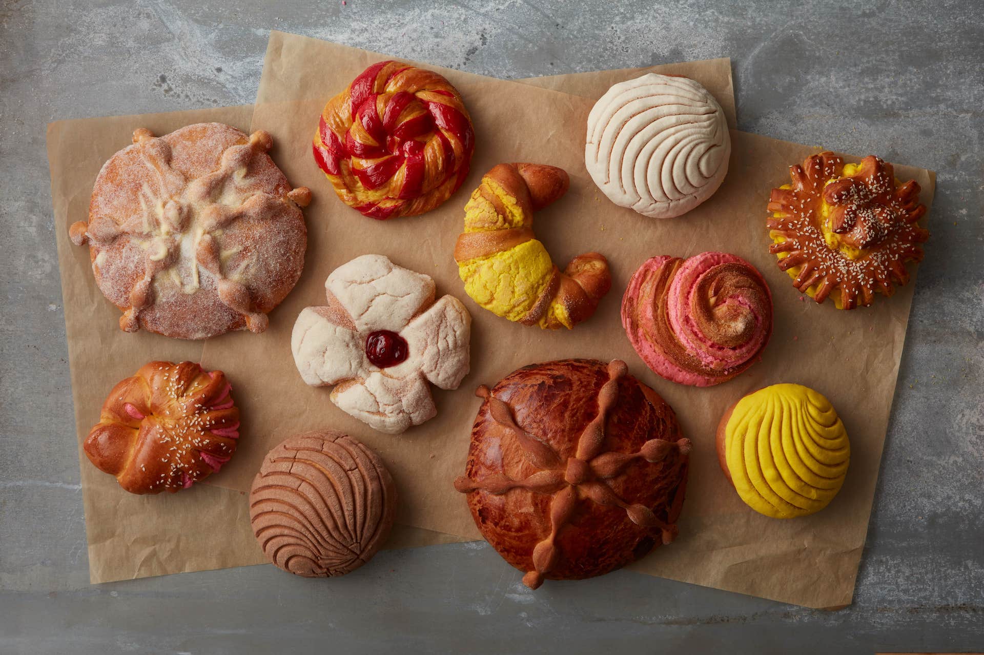 An assortment of hispanic pastries on parchment paper