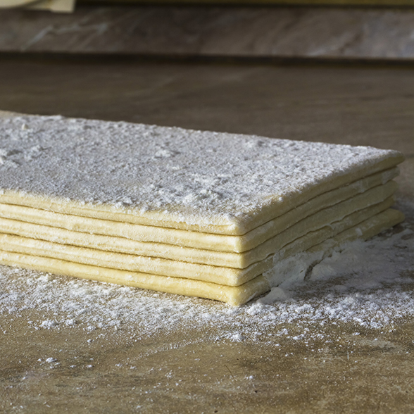 a stack of frozen laminated dough