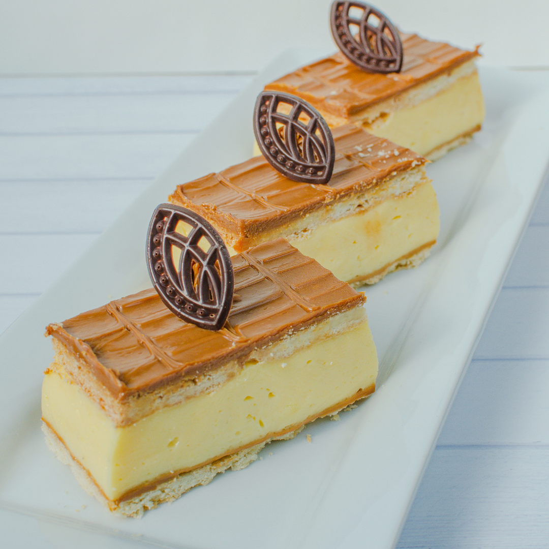Three caramel chocolate snot blocks on a white plate