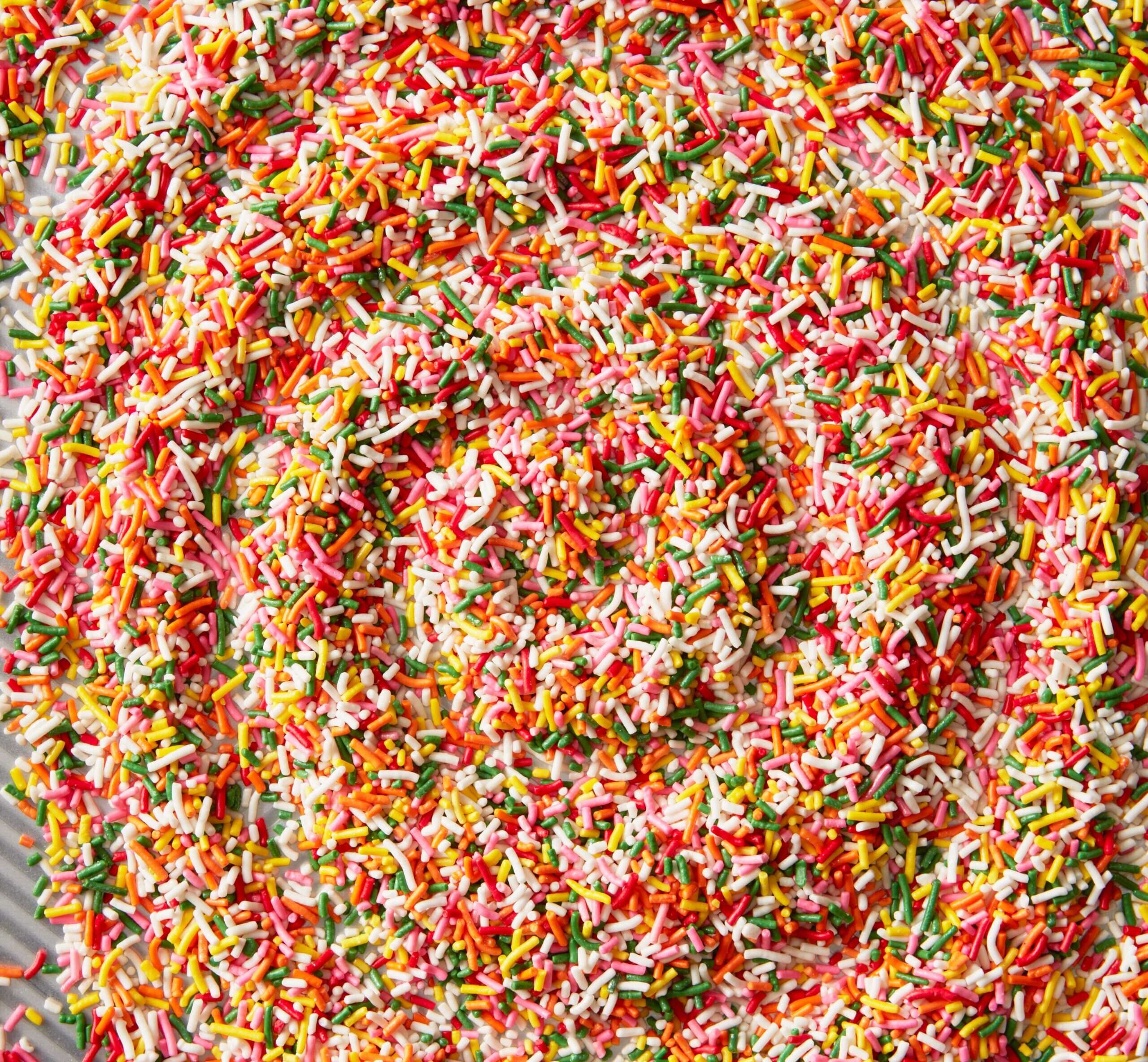 a overhead look at an assortment of sprinkles with a swirl