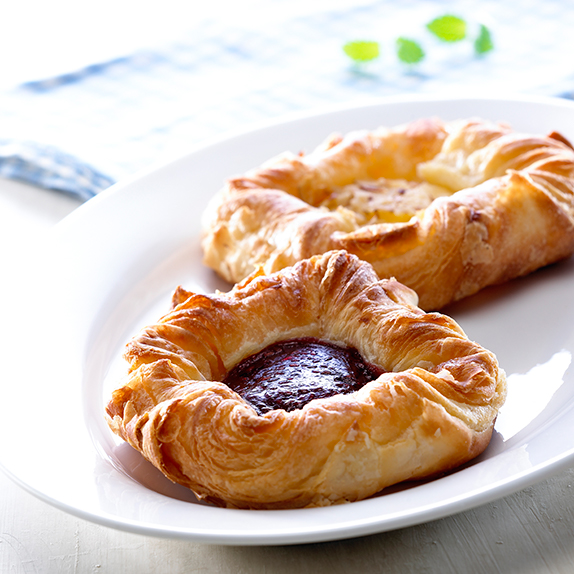 pastry squares filled with fruit filling on a white plate