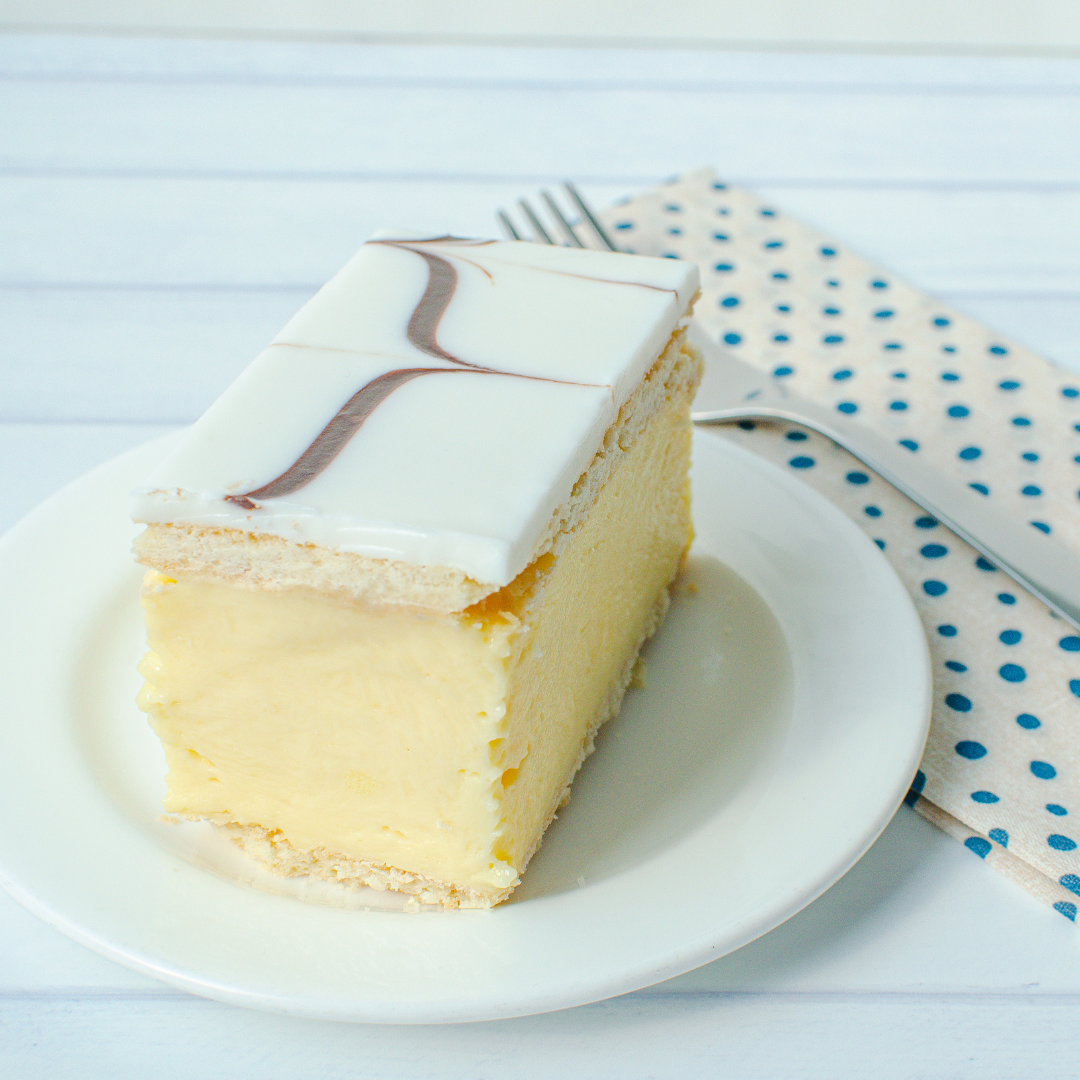 Snot block on white plate with blue patterned napkin and fork in background